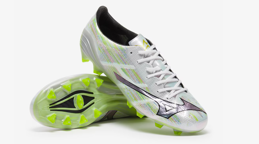 Pair of soccer cleats with a brand logo on a white background